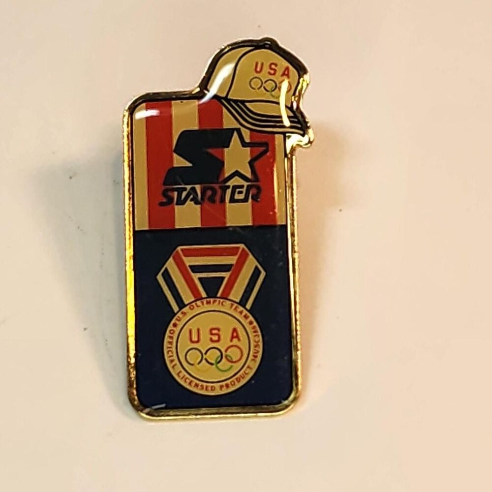 Vintage Starter USA Olympic Team Medal pin with gold, red, and blue Brooch